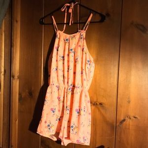 Bright floral romper with cute bow in back!